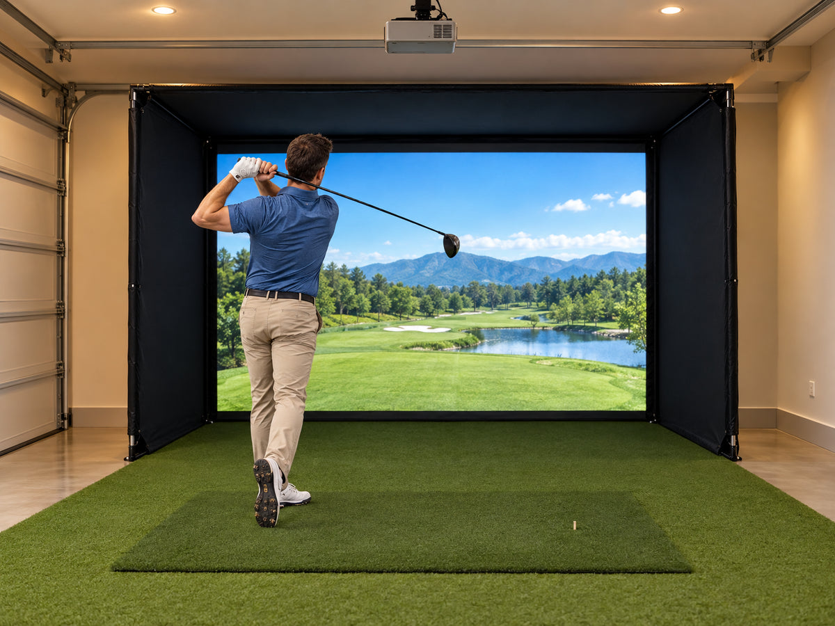Golf Simulator Enclosure Built for, golfer completing a full driver swing, club at full follow-through