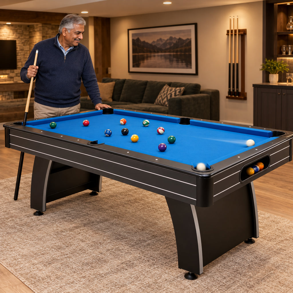Pool Table Built, an older man of South Asian descent standing at the side of the table, cue in hand